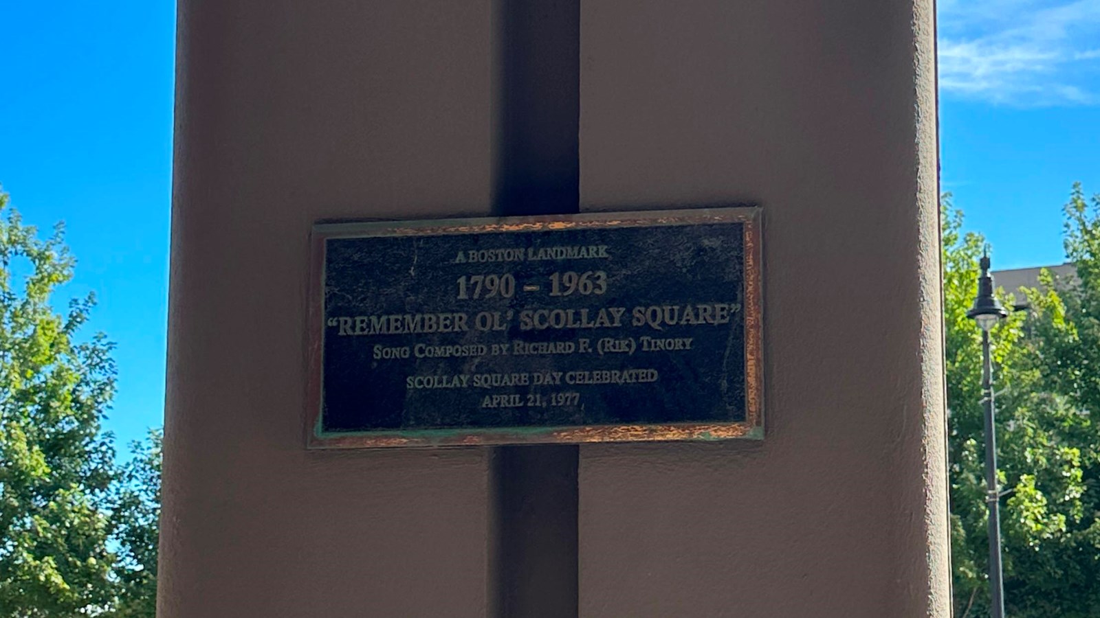 Photo of a bronze plaque that reads 