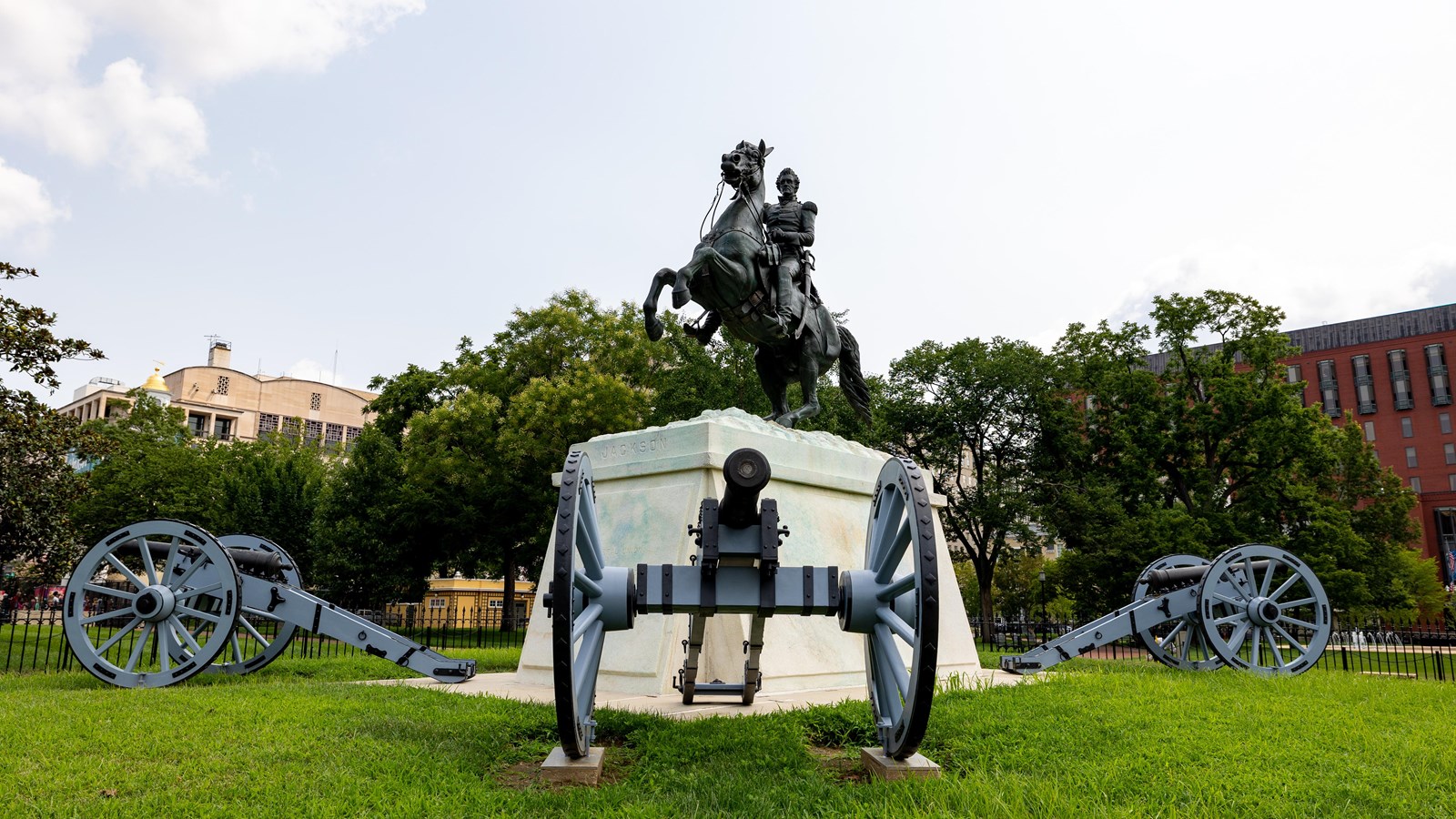 View of Andrew Jackson equestrian statue with three cannons visible around the statue base