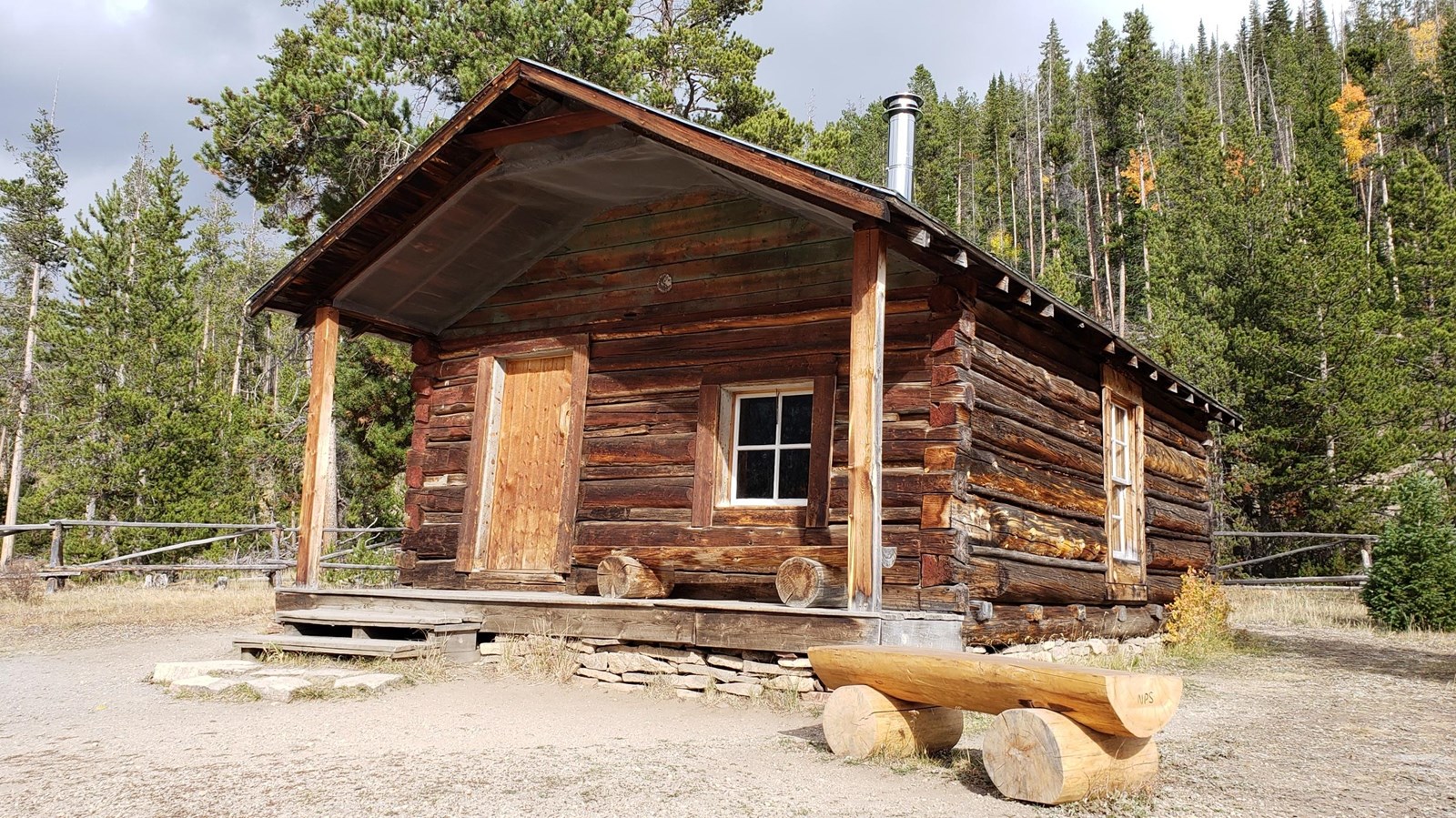 A historic log cabin at the entrance to the Holzwarth Historic Site
