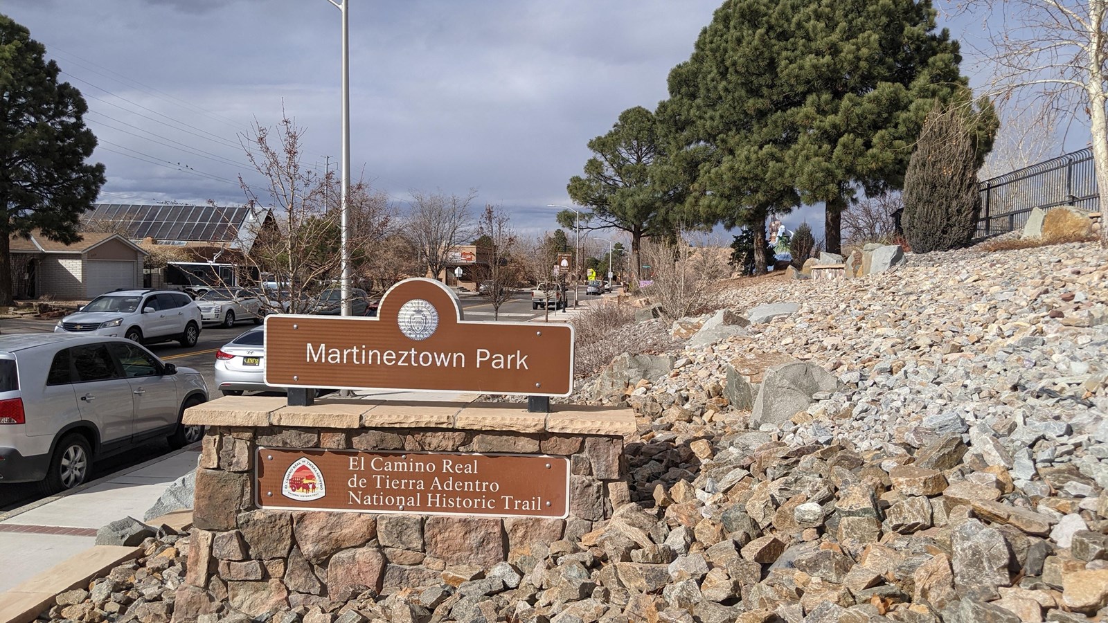 Brown and white monument sign for Martineztown Park