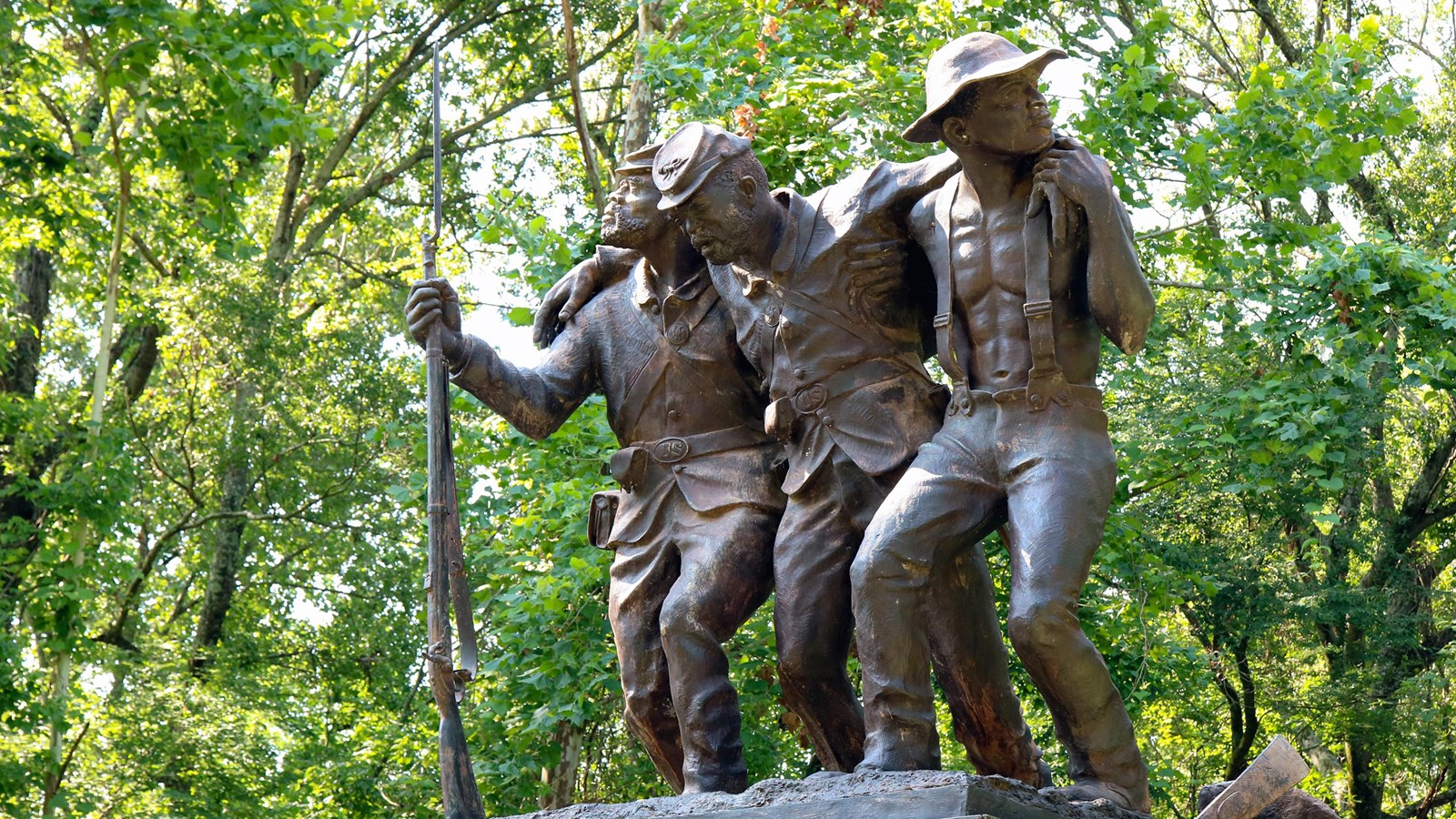Three statues of African American men symbolizing the service and sacrifices during the Civil War.