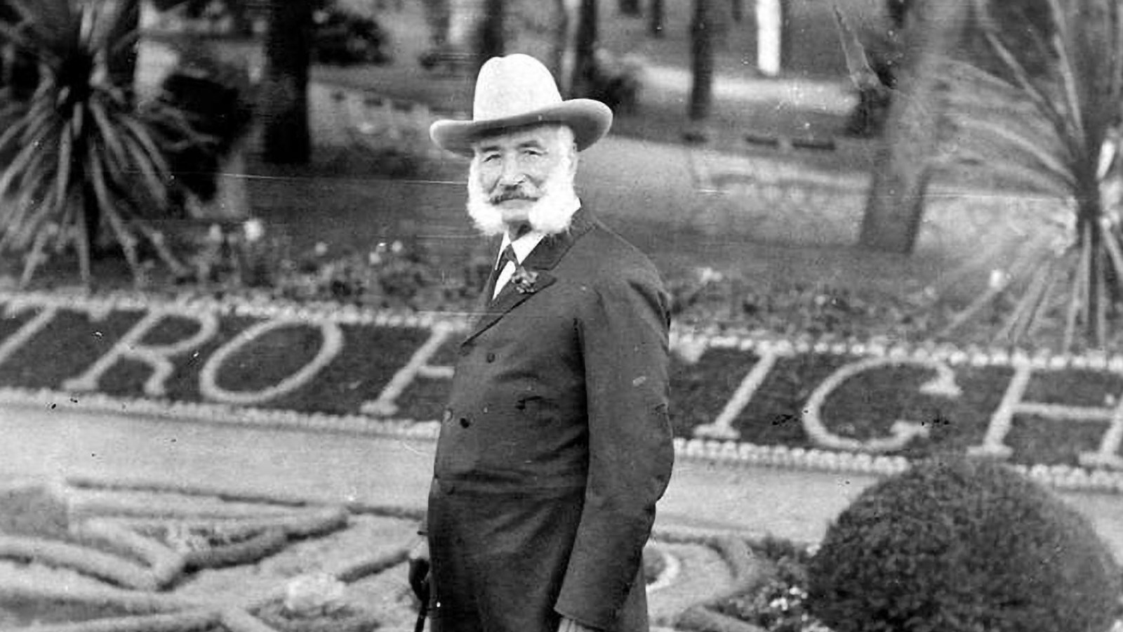  Adolph Sutro poses with a brimmed hat and cane at Sutro Heights.