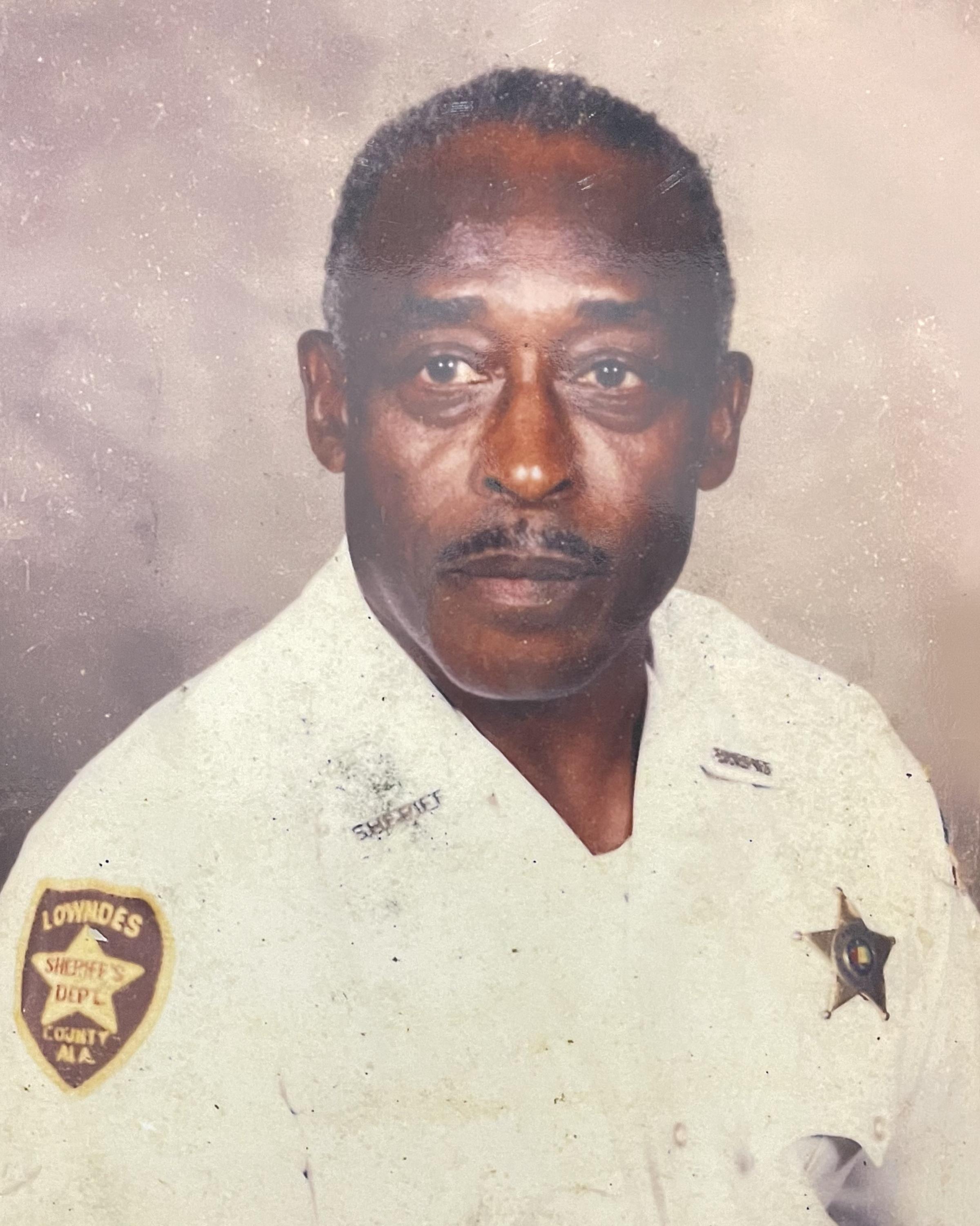 Portrait of the Black man in a sheriff uniform.