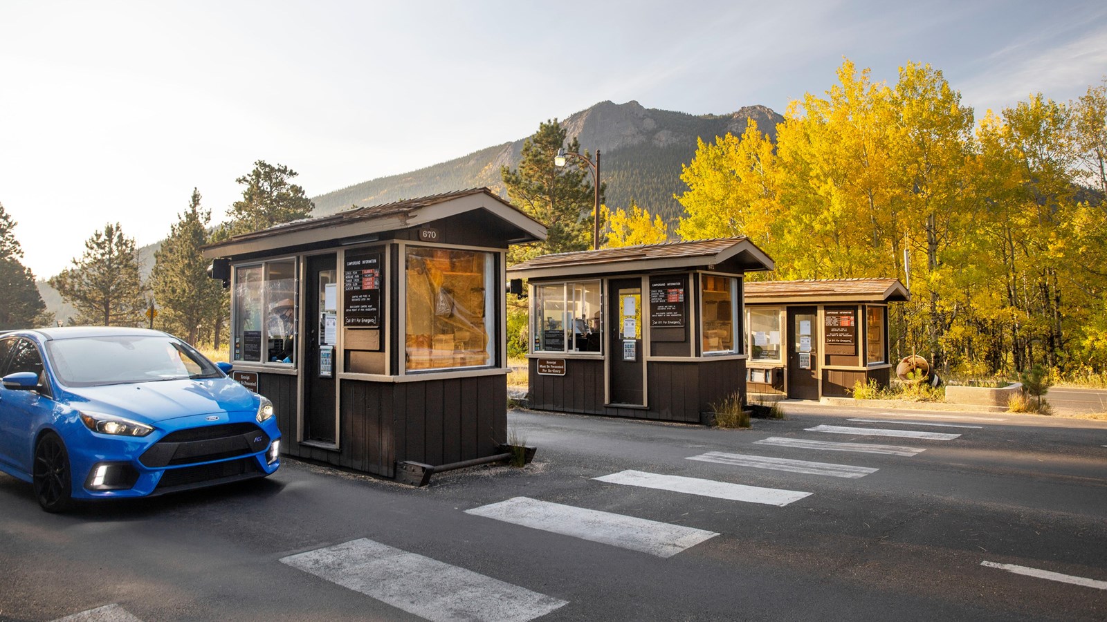 a car pulled up to an entrance booth