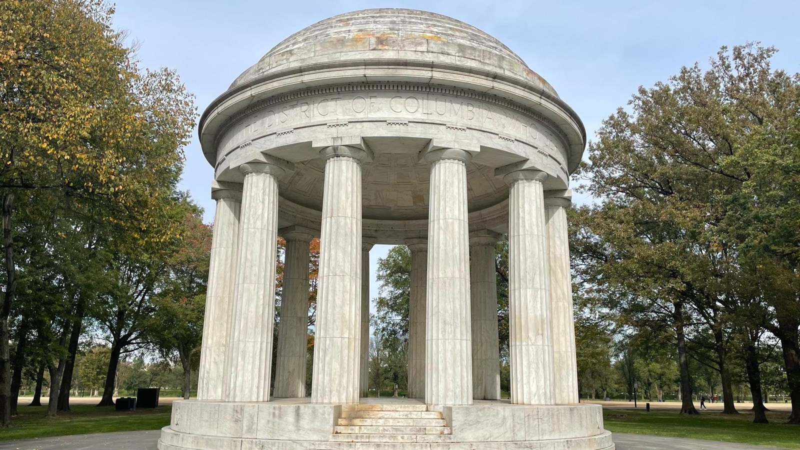 Circular colonnaded pavilion set among trees