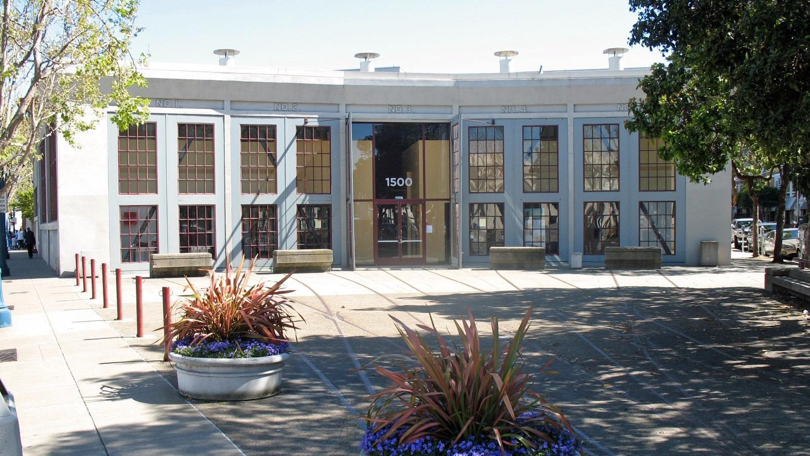 Photo of one story building. 