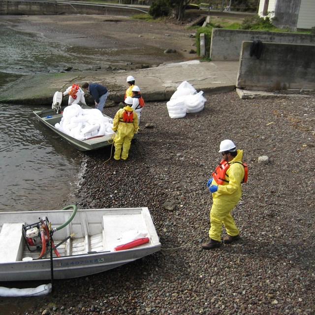 Oil spill response workers gather materials to respond to an event.