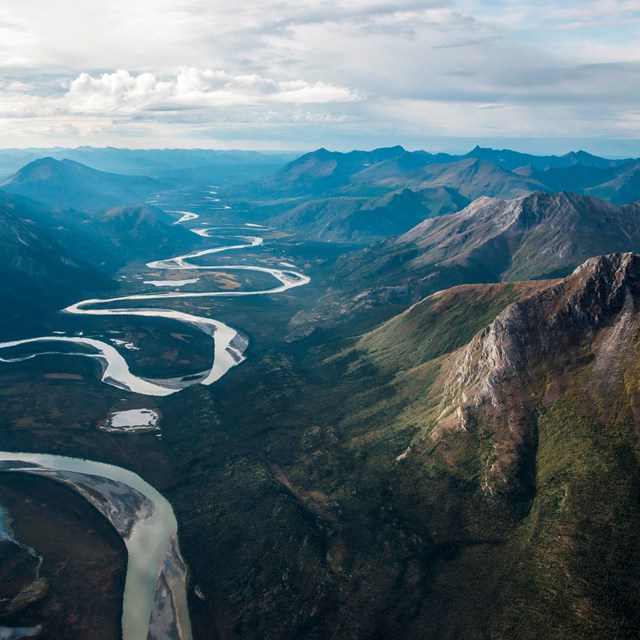 Aerial view of a river winding through the Brooks Range mountains