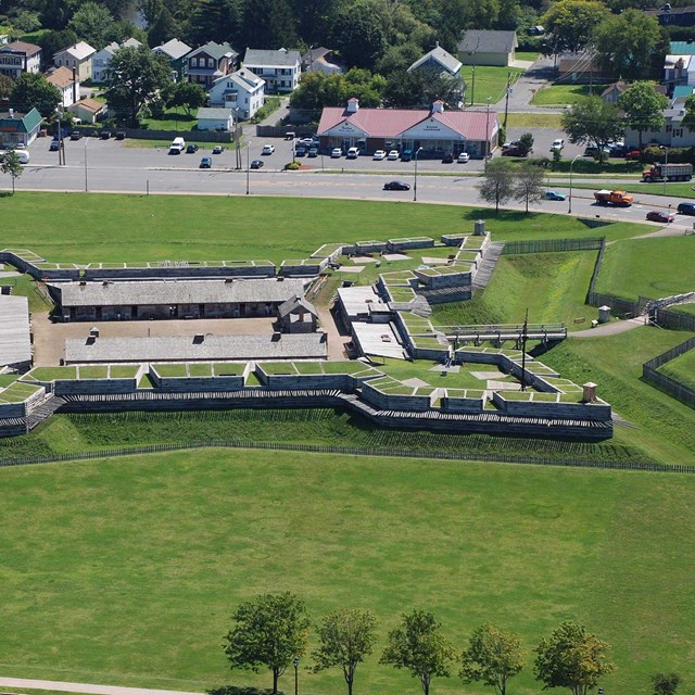 a start fort seen from the air surrounded by green grass