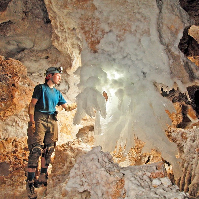 A Caver lights up a gypsum chandelier