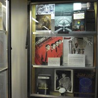 Exhibit displays showing old records. 