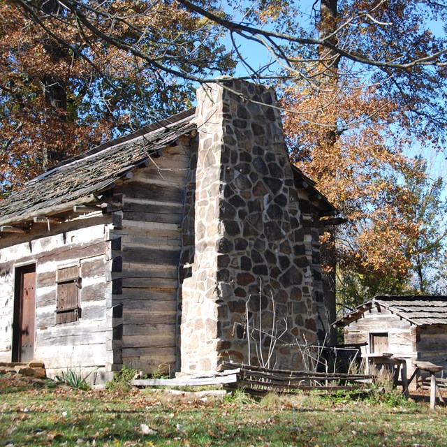 Log cabin with an outbuilding