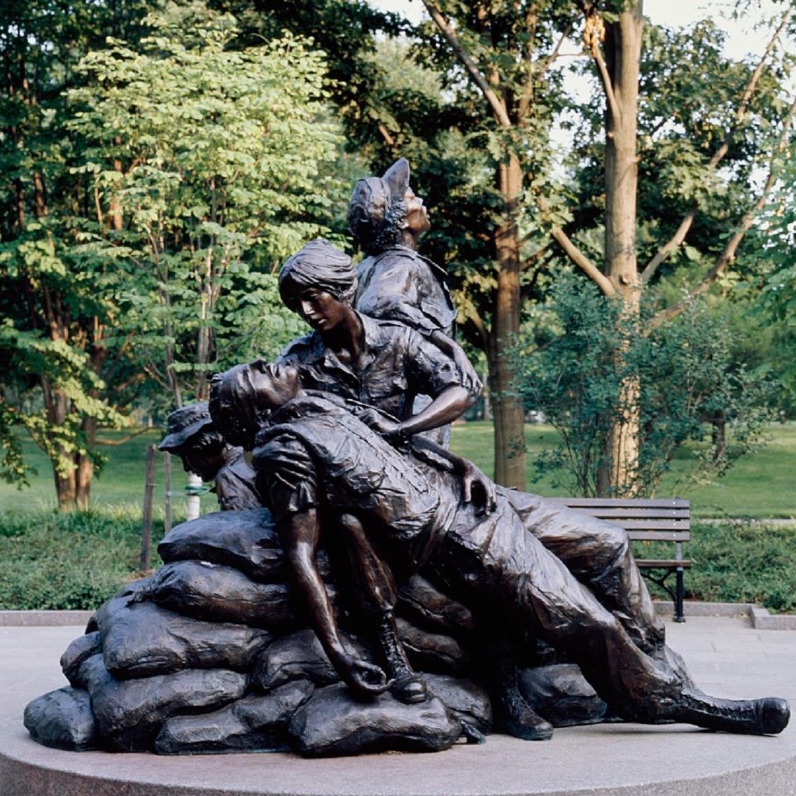 Statue of two women caring for fallen soldier.