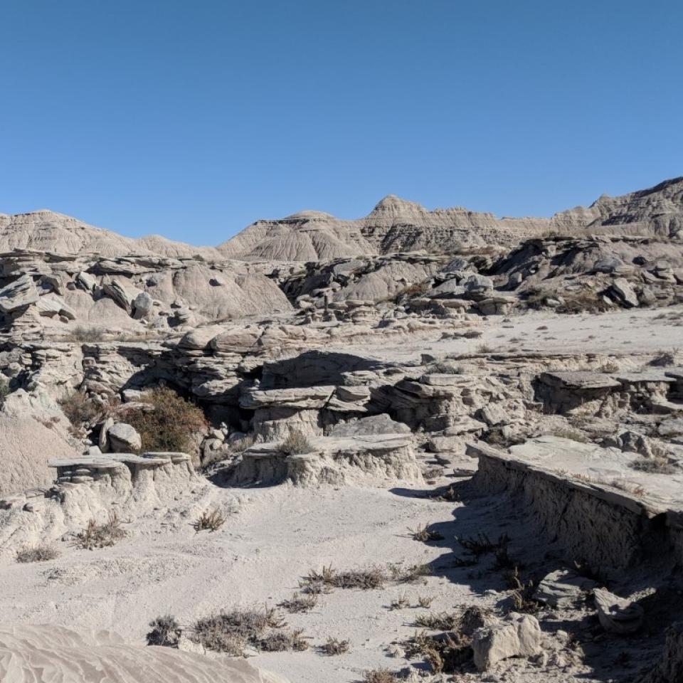 hard sandstones layer with soft clays to produce buttes with large toadstool rock formations.