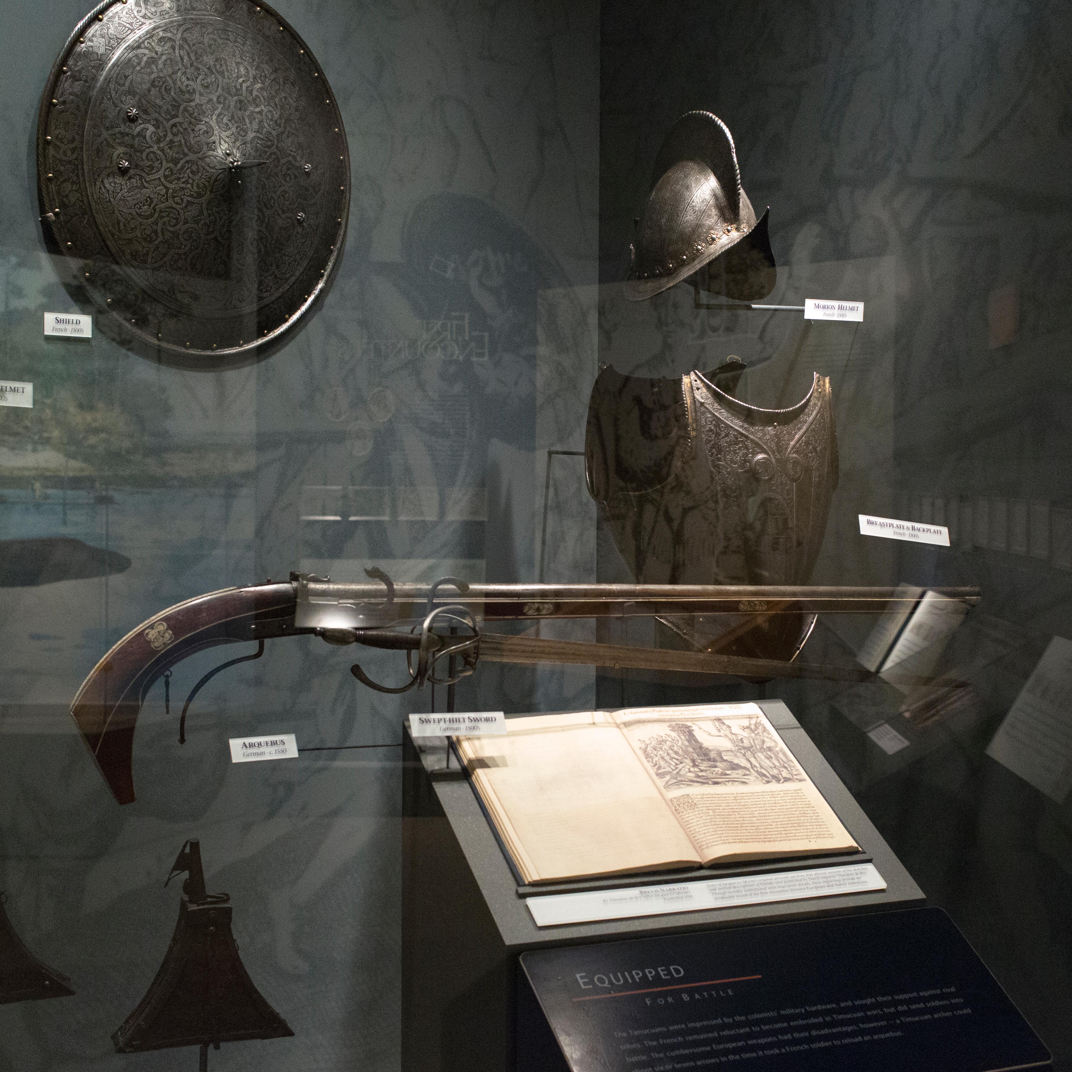 a glass display case with french armor
