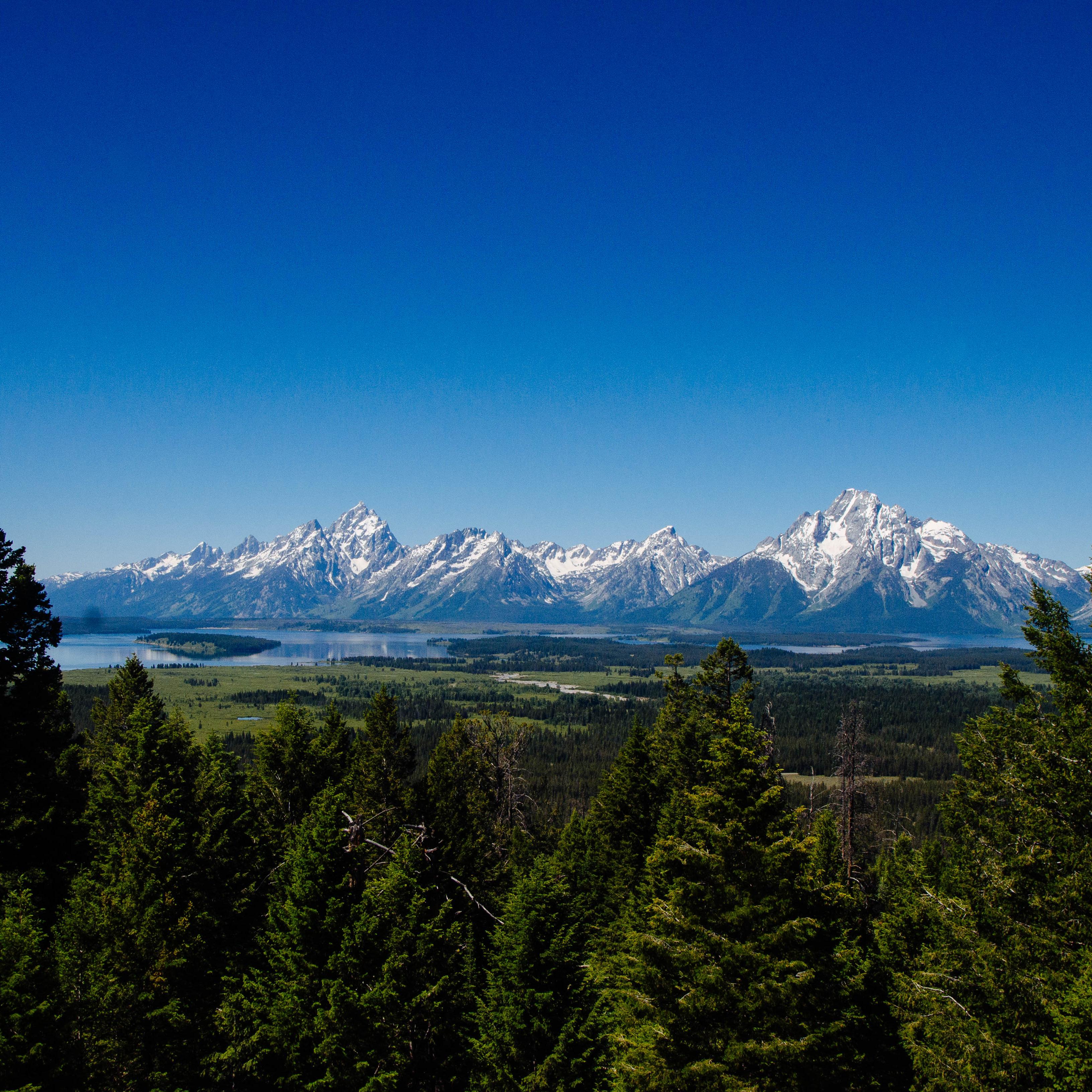 A mountain range and a lake as viewed from a high vantage point.