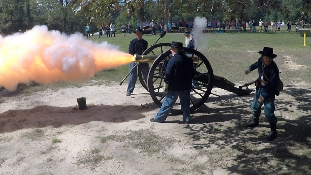 Fire and smoke belch from a bronze cannon.