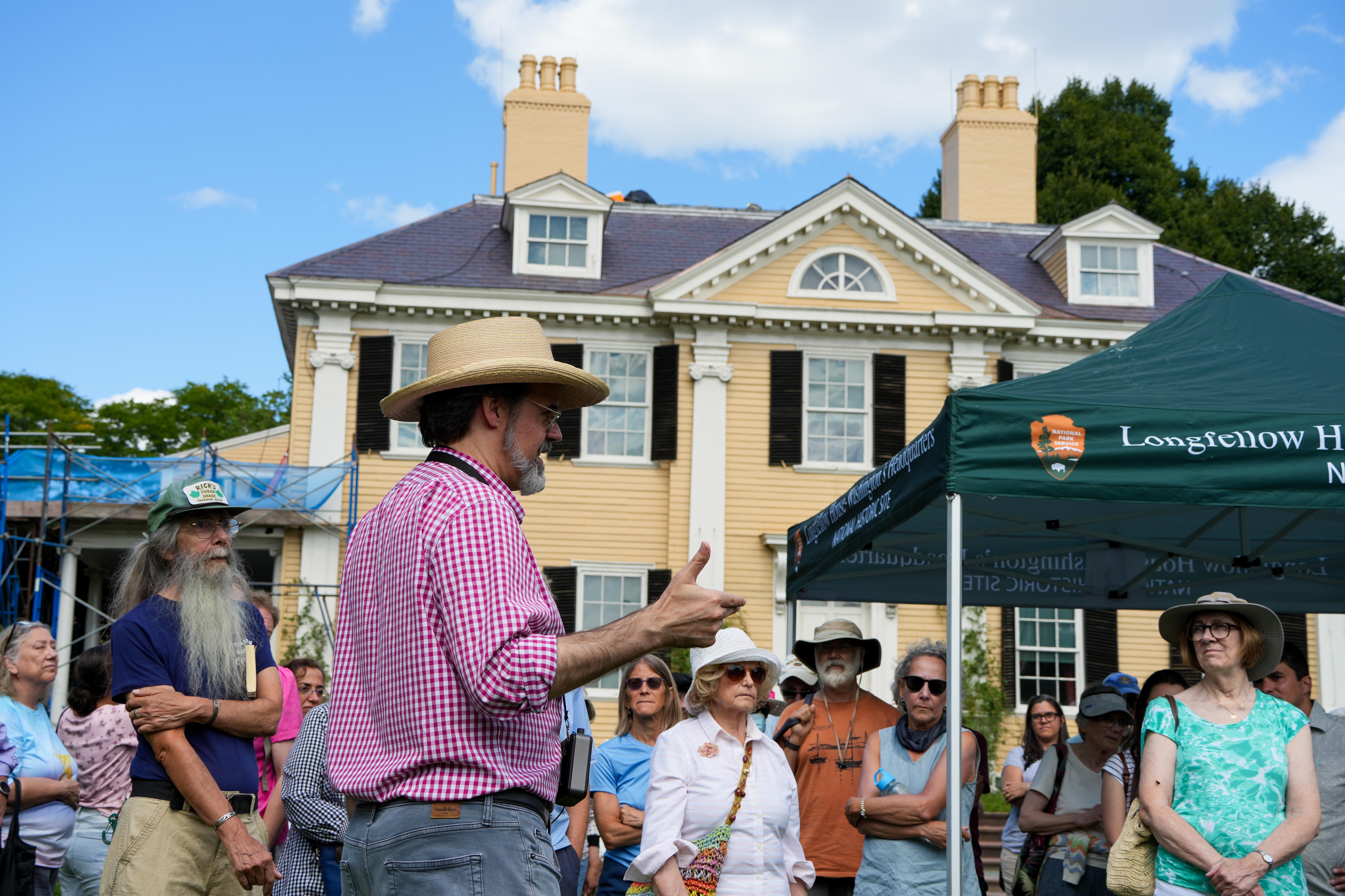 Tour guide with a large crowd outdoors