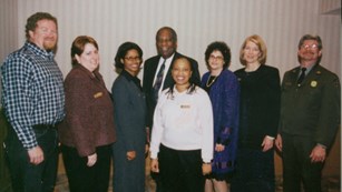 Group photo of 8 people from Network to Freedom launch event in 2000.