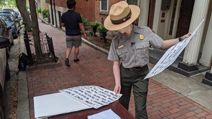 A photograph of Park Rangers developing a video.
