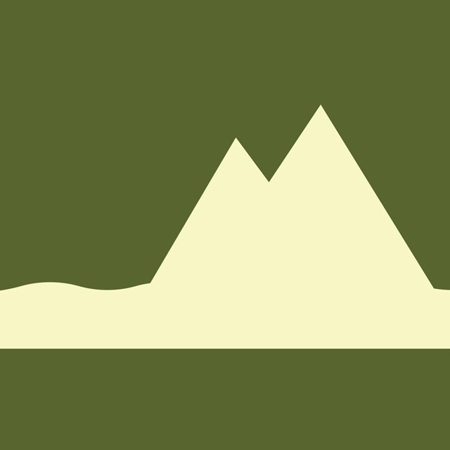 Green background with white icon of a mountain. 