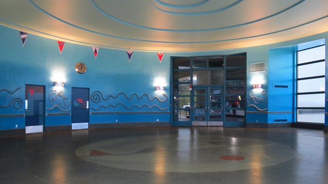Curving ropes on the blue walls and nautical flags decorate the round room at Aquatic Park.