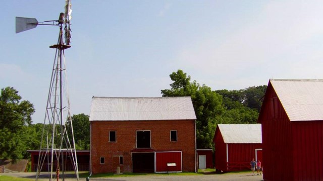 Red barns with wind mill at Oxon Hill Farm & Oxon Cove Park