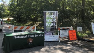 a table and find your park sign at the entrance of Greenbelt Park Maryland 