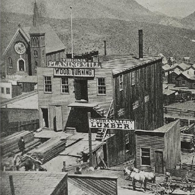 View of C Street in Virginia City, Nevada with church, lumber shop, planing mill, and school. 1866 