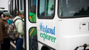 people board an island explorer bus