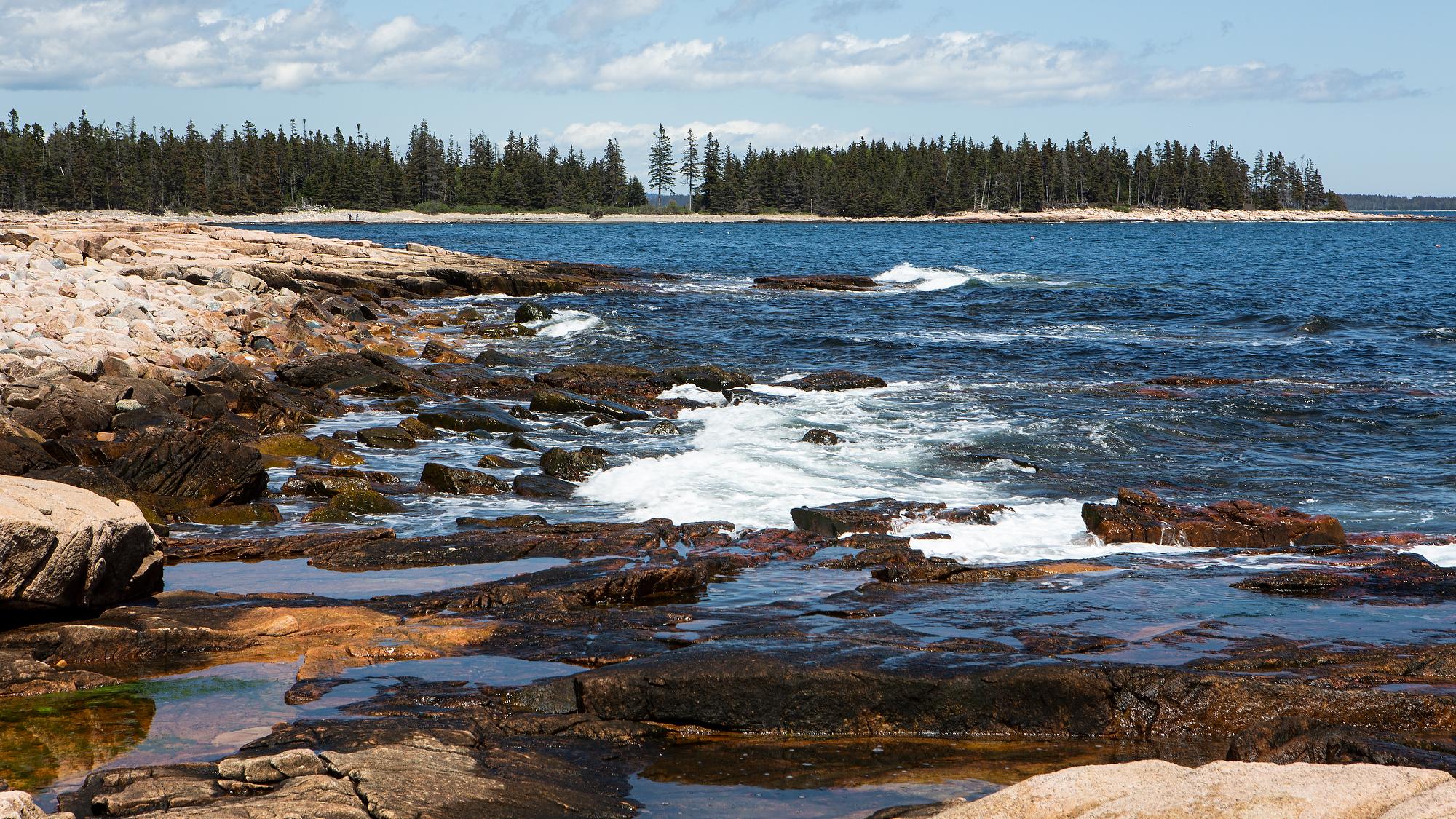 Rugged coastline with waves crashing into rocks
