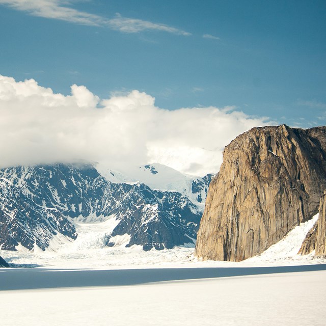 a vast, level glacier surrounded by craggy mountains