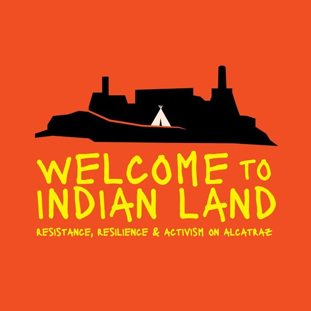 Black silhouette of an island with rectangular buildings and smokestacks sits against a red-orange b