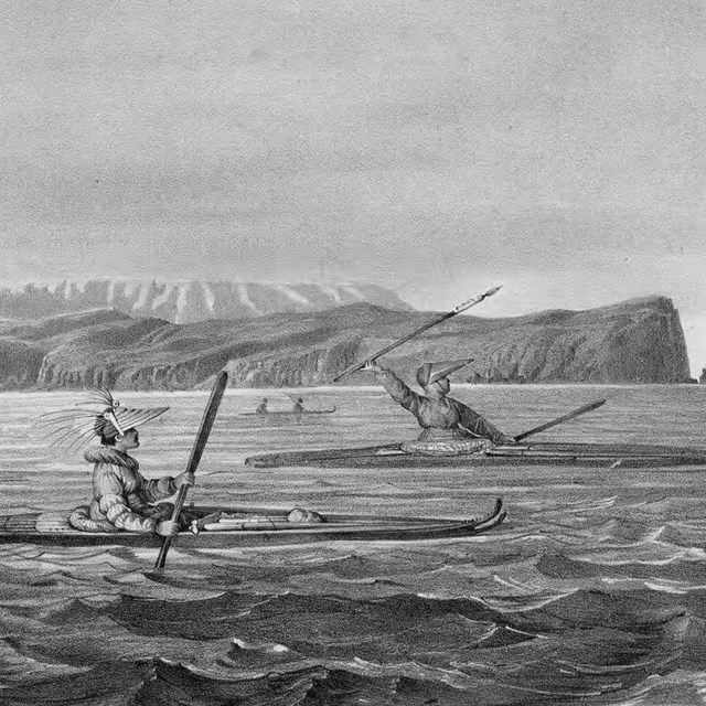 a historic illustration of two men in kayaks paddling in front of a coastal mountain range.`