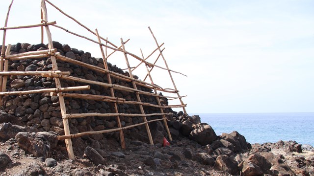 Historic rock structure under repair.