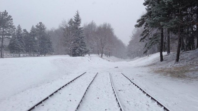 A park trail with snow.