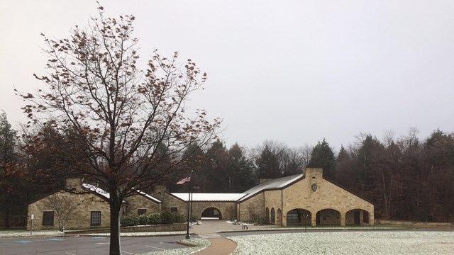 The Visitor Center stone exterior with a dusting of snow.