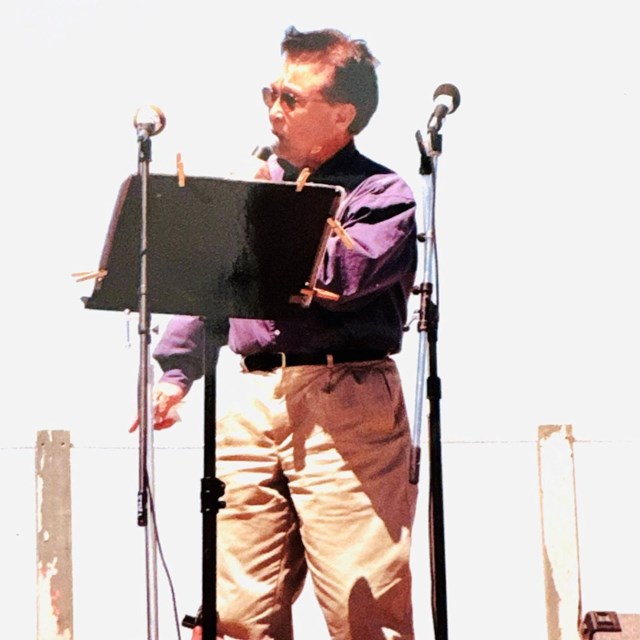 A man standing on stage giving a speech