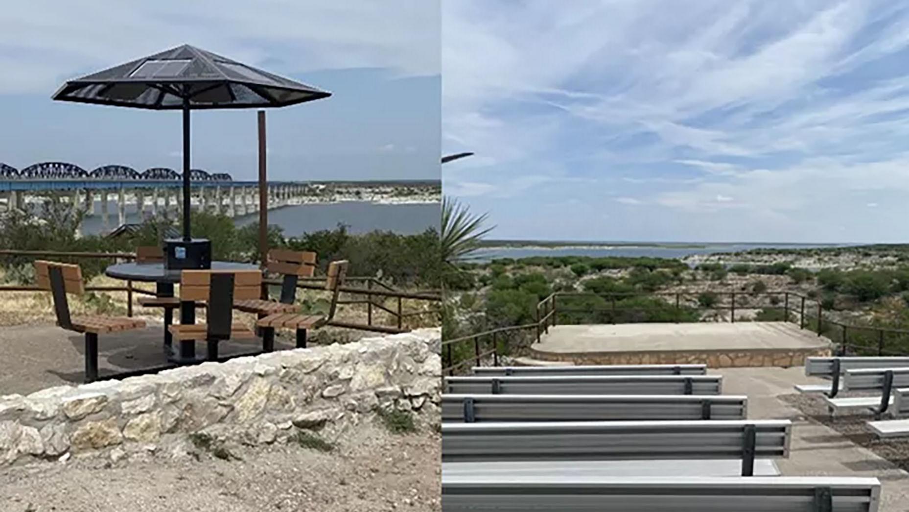Solar charging umbrella over a picnic table overlooking lake and railroad bridge and amphitheater.