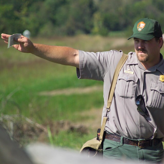 Park rangers talking with visitors.