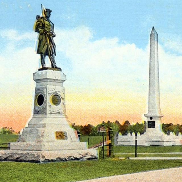old postcard of monuments and cars