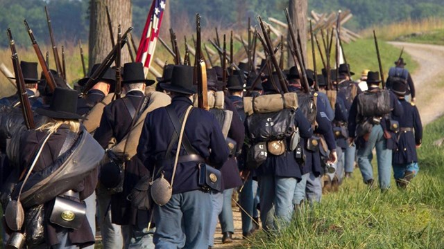 Federal Troops marching with rifles in hand