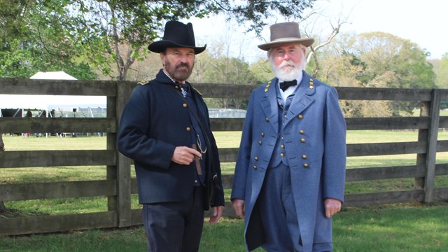Two men portraying Generals Grant and Lee pose for a photo.
