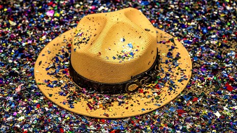 NPS straw ranger hat covered in multicolored confetti