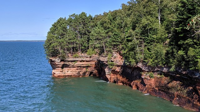 View of the sea caves from the Mainland Trail.