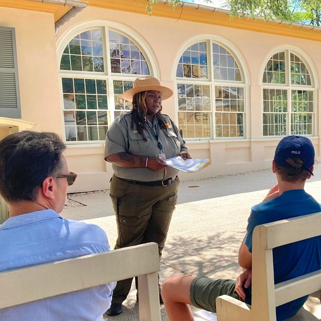 A ranger talking to visitors.