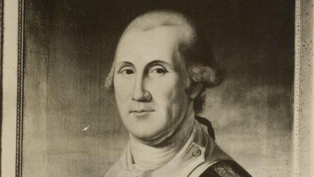 portrait of George Washington with a white wig and wearing a military uniform
