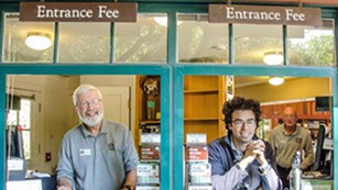 Staff at Muir Woods visitor center smiling and ready to welcome visitors