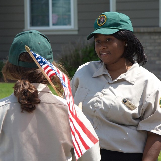 Two NPS volunteers talking