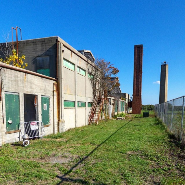 Photograph of seaplane hangar with blue sky